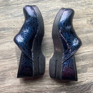 Navy blue Dansko clogs. Floral print.